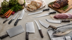 A task-based selection of generic kitchen knife types shown with representative foods.